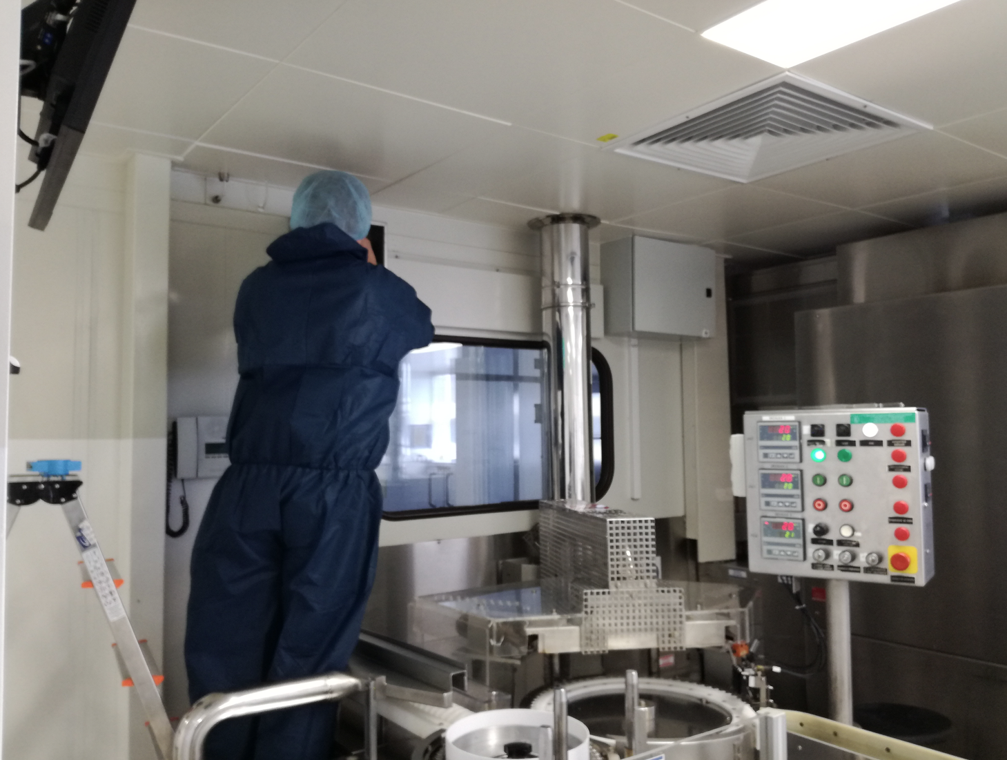 people installing hardware on factory